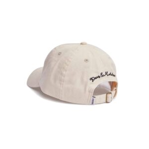 Shapers-Club- Une casquette de baseball beige avec un logo noir dessus. -surfshop-surfboard